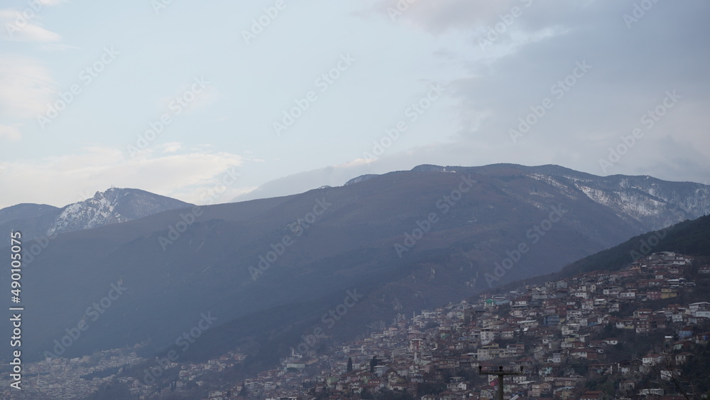 Mountain and City View in Cloudy Weather