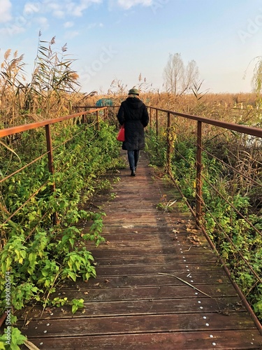 woman walking on a bridge
