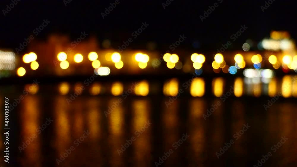 Defocused lights of Prague old town at night from Charles Bridge Defocused lights of Prague old town at night from Charles Bridge