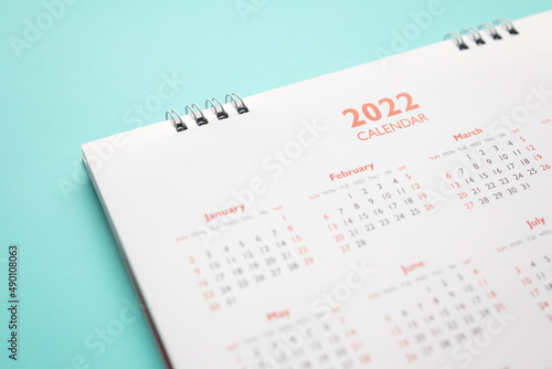 2022 calendar page on blue background business planning appointment meeting concept © Piman Khrutmuang