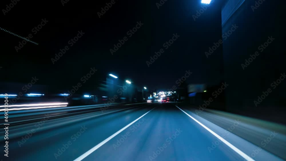 Motion Timelapse of The Night Rush Drive In A Big City. Speedy Car Driving The Highway With Lights and Traffic. Hyperlapse Road Trip Travel Concept Sort of Dashcam POV Motion Timelapse of The Night Rush Drive In A Big City. Speedy Car Driving The Highway With Lights and Traffic. Hyperlapse Road Trip Travel Concept Sort of Dashcam POV