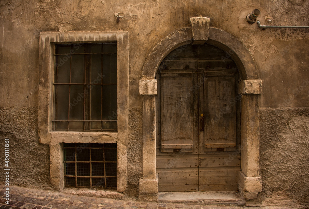 An historic wooden door in a derelict medieval building in central Rovereto in Trentino, north east Italy
An historic wooden door in a derelict medieval building in central Rovereto in Trentino, north east Italy