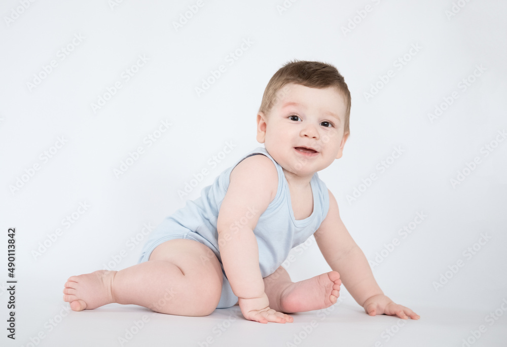 child baby boy sitting happy smiling boy on a white 7 month background child baby boy sitting happy smiling boy on a white 7 month background