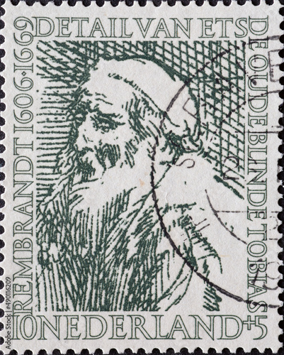 Netherlands - circa 1956: a postage stamp from the Netherlands , showing a portrait of The Old and Blind Tobias, by Rembrandt photo