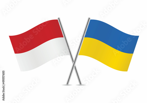 Monaco and Ukraine crossed flags. Monegasque and Ukrainian flags, isolated on white background. Vector icon set. Vector illustration.