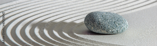 Photography Japanese ZEN garden with yin yang stone in textured sand