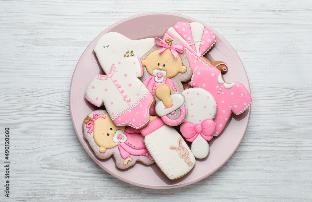 Cute tasty cookies of different shapes on white wooden table, top view. Baby shower party Cute tasty cookies of different shapes on white wooden table, top view. Baby shower party
