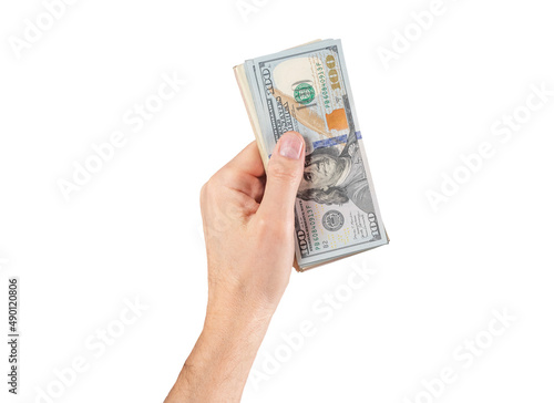 Hand holding US dollar bills wad isolated on white background. Money and currency concept. High quality photo