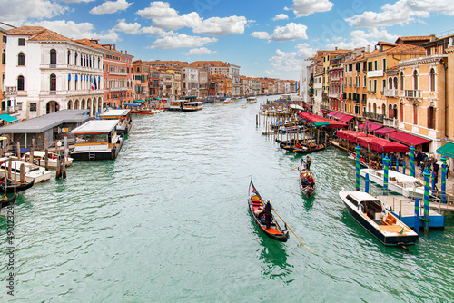View of the Grand Canal from the Rialto Bridge in Venice with boats and gondolas