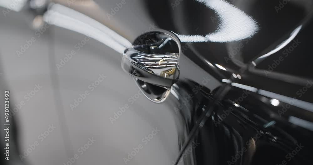 Close up of the shiny car details after polishing and waxing, car