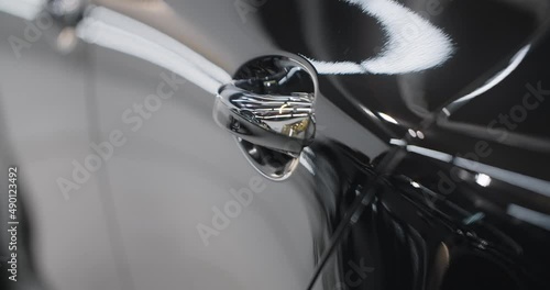 Close up of the shiny car details after polishing and waxing, car detaling center, automotive care, 4k 60p