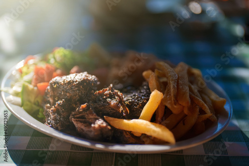 Fotografija Traditional Greek Beef Stifado with rice and french fries.