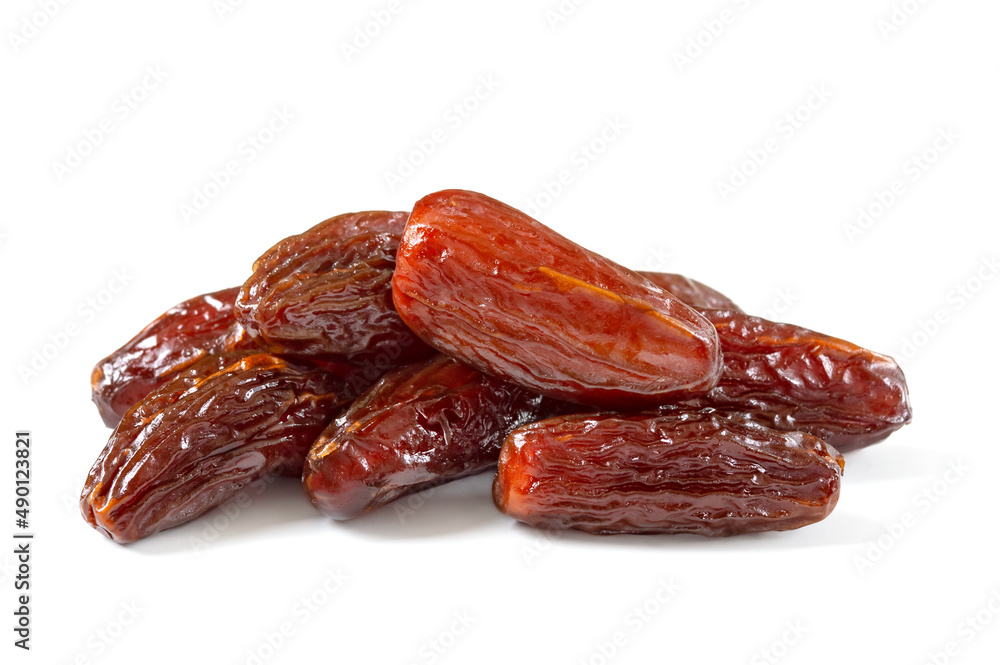 Pile of tasty dry dates isolated on white background. Arabic food
