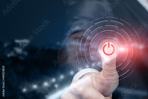 Hand presses the start button .