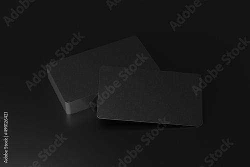 Realistic rounded corners floating business black branding card mockup with shadows for graphic design template. Blank credit card mockup above of a stack of cards on a black background. 3D render