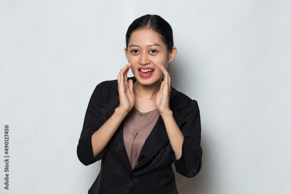 Asian business woman shouting and yelling announcing
Asian business woman shouting and yelling announcing