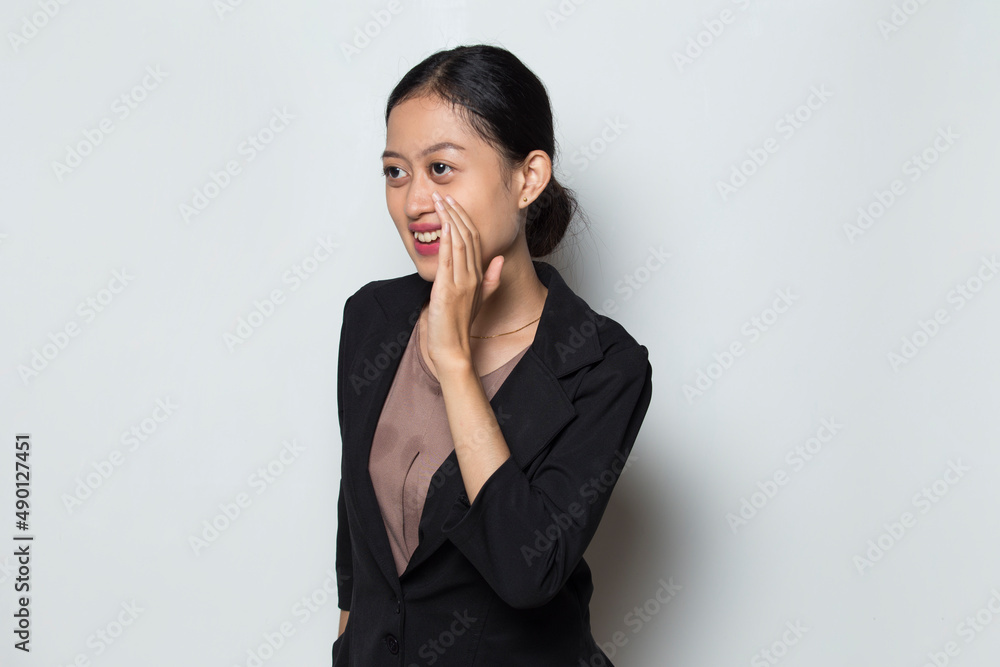 Asian business woman shouting and yelling announcing
