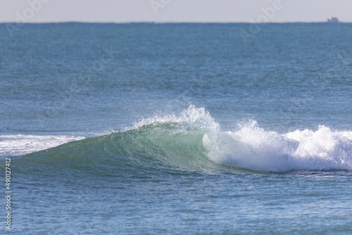 Wave breaking in the sea.