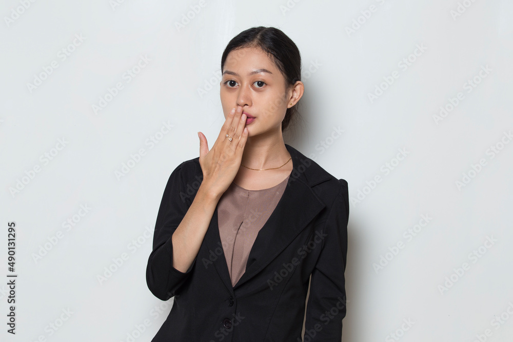 Young asian business woman shocked covering mouth with hands for mistake. Secret concept.
Young asian business woman shocked covering mouth with hands for mistake. Secret concept.