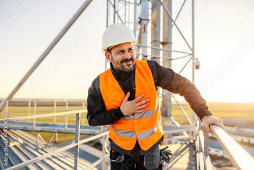 An industry worker feels nauseous because of big height.