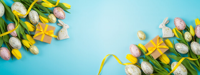 Easter holiday banner design with easter golden eggs, gift box and yellow  tulip flowers. Top view with copy space