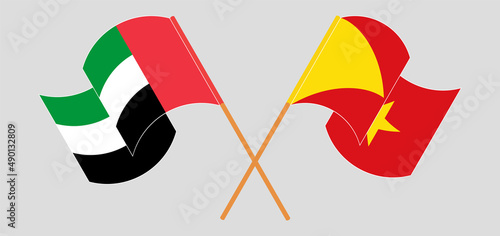 Crossed and waving flags of the United Arab Emirates and Tigray