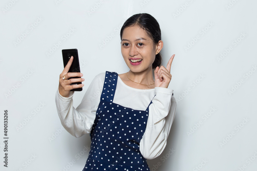 young asian woman using mobile phone isolated on white background
young asian woman using mobile phone isolated on white background