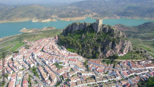 aerial view of medieval Andalusian white village near a blue lake, Iberian landmark and Spanish tourist destination, the village of Zahara de la Sierra