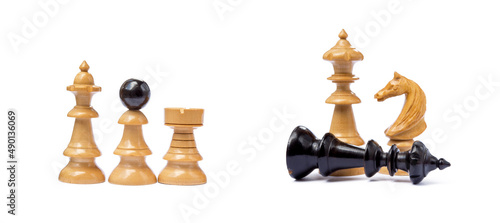 Old chess pieces isolated on white background