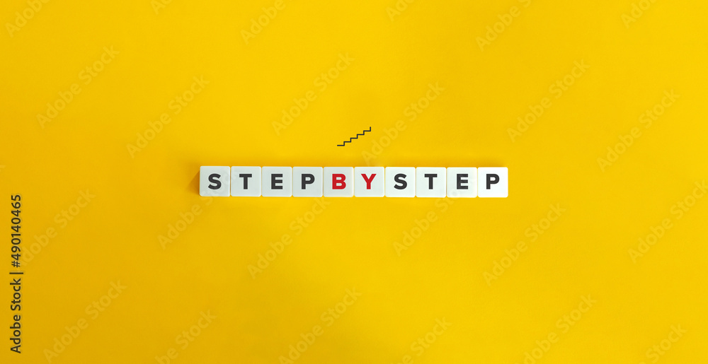 Φωτογραφία Step by Step Phrase on Letter Tiles on Yellow Background