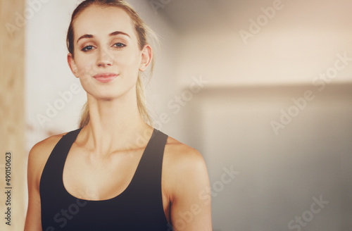 The gym is like my second home. Cropped portrait of an attractive young woman working out in the gym. © Yuri A/peopleimages.com