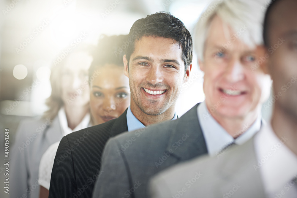 I love being part of this team. Cropped portrait of a group of diverse businesspeople standing in a line. I love being part of this team. Cropped portrait of a group of diverse businesspeople standing in a line.