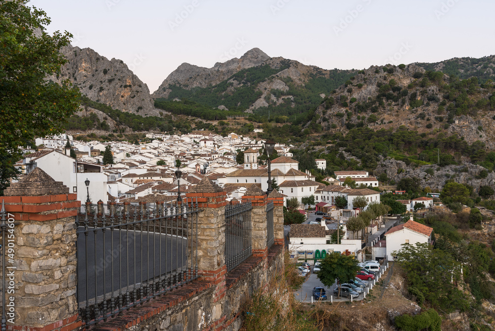 Panoramic view of the beautiful andalusian white town of Grazalema among mountains from El Tajo viewpoint at sunrise, Cadiz, Andalusia, Spain