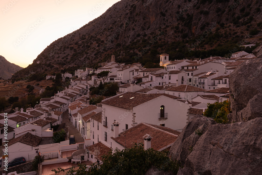 Fototapeta premium Panoramic view of the beautiful andalusian white town of Villaluenga del Rosario in Grazalema mountain range at sunset, Cadiz, Andalusia, Spain