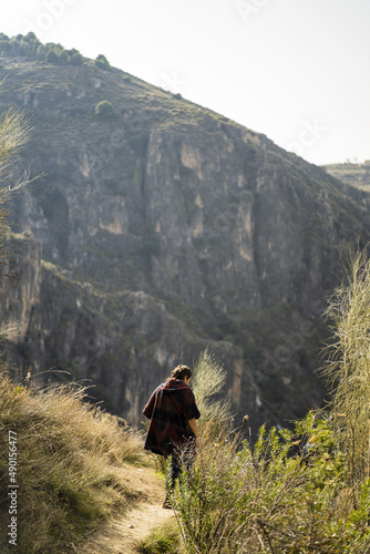 Caucasian female traveler enjoys the scenic view of Sierra Nevada mountain landscapes in Granada photo