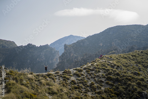 Caucasian female traveler enjoys the scenic view of Sierra Nevada mountain landscapes in Granada photo