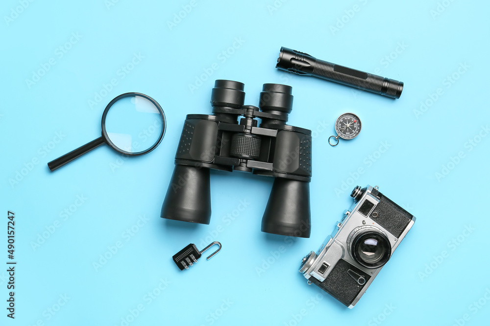 Set of travel items with photo camera on color background Set of travel items with photo camera on color background