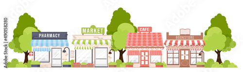 Small town street with cartoon city pharmacy, market, cafe, bookstore buildings and trees. Modern, cute flat vector illustration isolated on white background. Stores facades, trees and shrubs