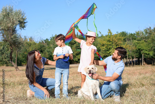Happy family with cute dog ...