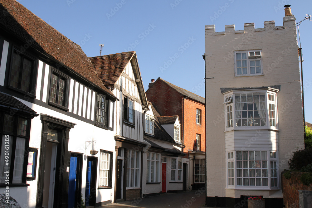 Fototapeta premium Period houses in various styles during summertime in Shakespeare country. Butter Street, Alcester, Warwickshire, UK.