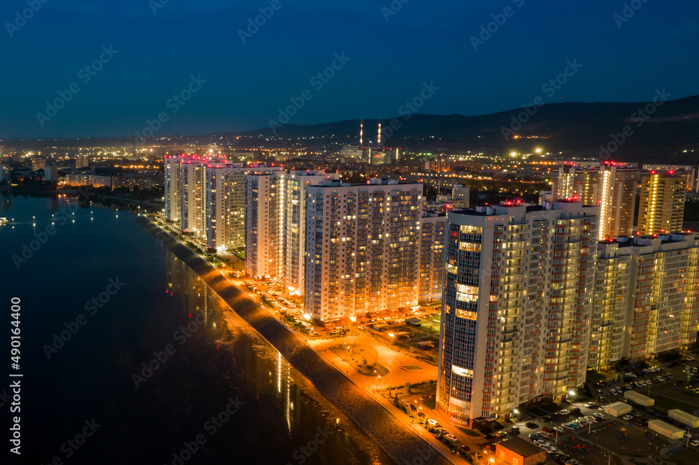 Residential area, high-rises at night, drone view