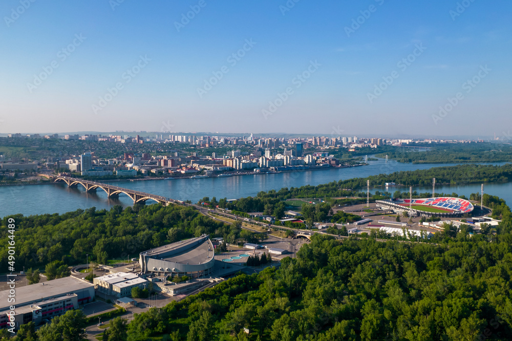 Top view of the city of Krasnoyarsk, the stadium, the Yenisei River, the bridge