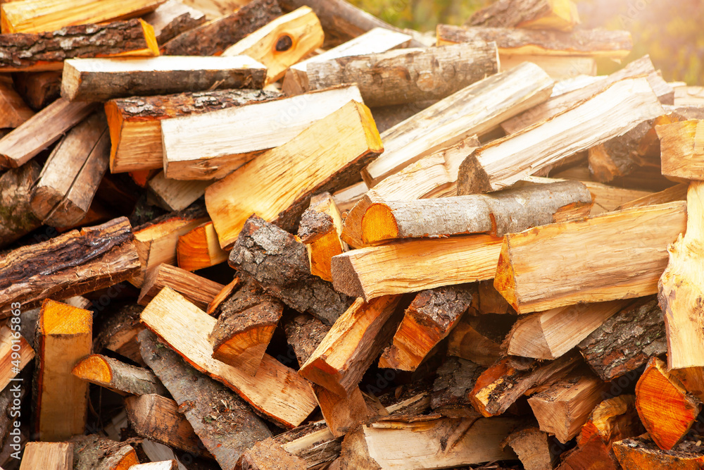 Background in the form of firewood chopped for heating the house. Background in the form of firewood chopped for heating the house.