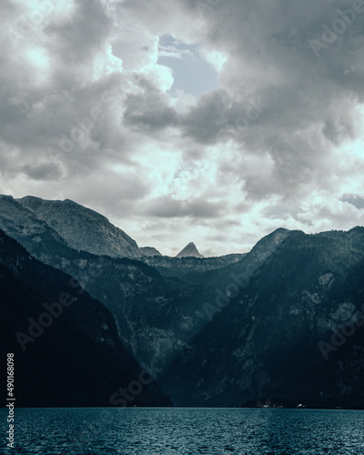 Canvas Print Vertical of a sea against mountains covered with green forests in Konigssee, Bav