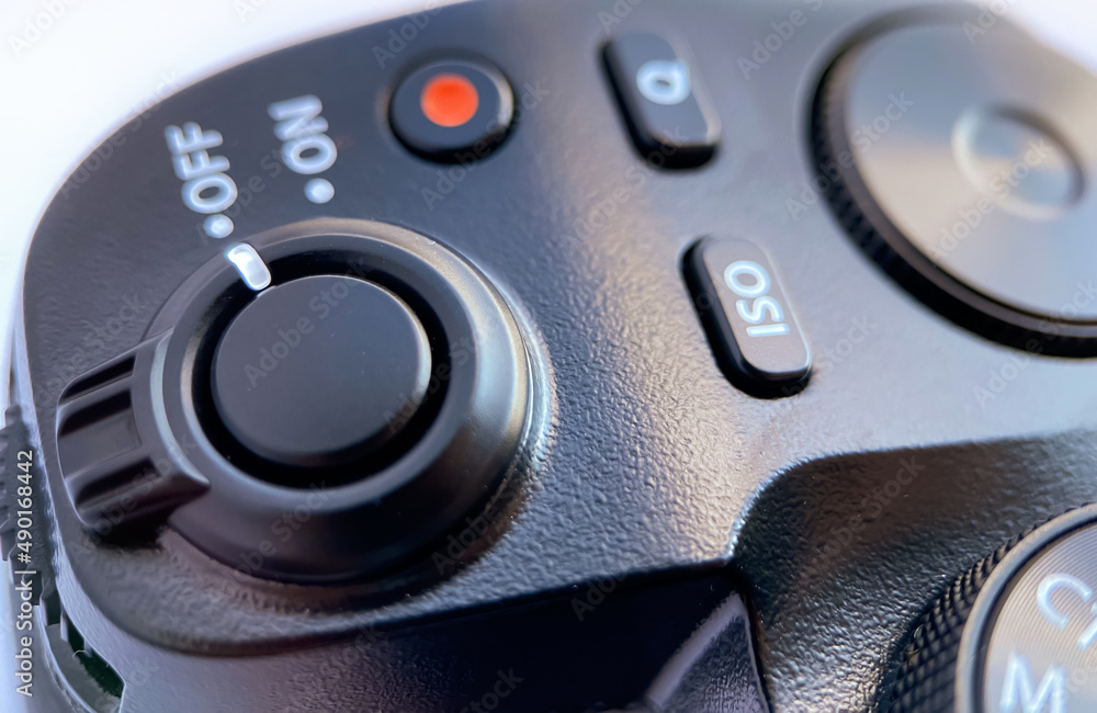 Close-up of the cameras shutter lever, iso sensitivity selection buttons, quick menu and video recording mode Close-up of the cameras shutter lever, iso sensitivity selection buttons, quick menu and video recording mode