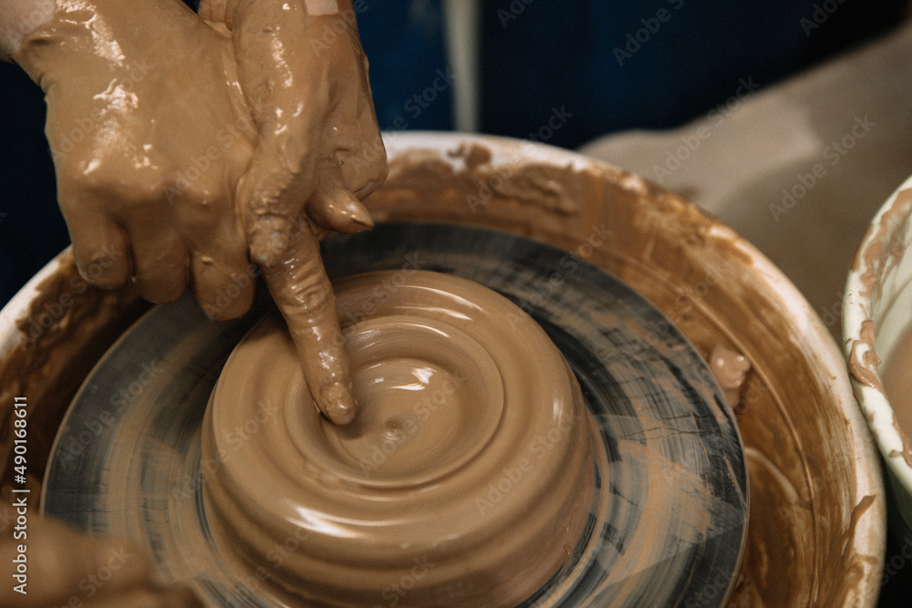 Fototapeta premium hands of a potter at work