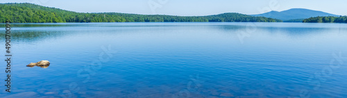 Panorama view of totally flat water on Somerset Reservoir Vermont in the summer.
