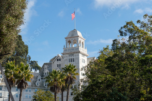 Historic Claremont Hotel with an American flag waving photo