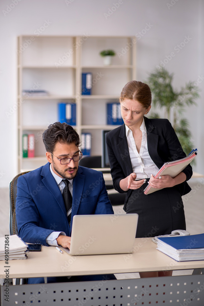 Two colleagues working in the office Two colleagues working in the office