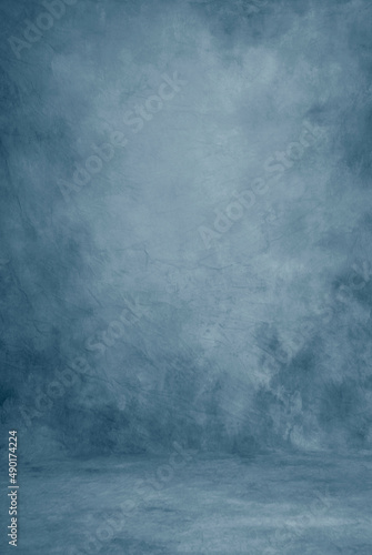 Classic blue photography studio portraiture cloth background or backdrop, beautiful paint strokes. 